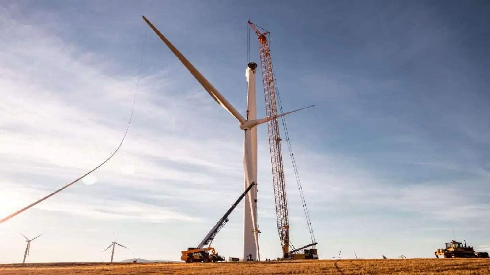 Wind turbine installation with crane at construction site
